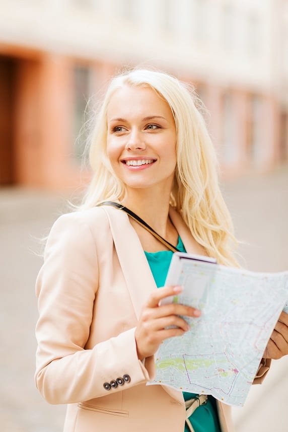 Woman carrying a tourist map