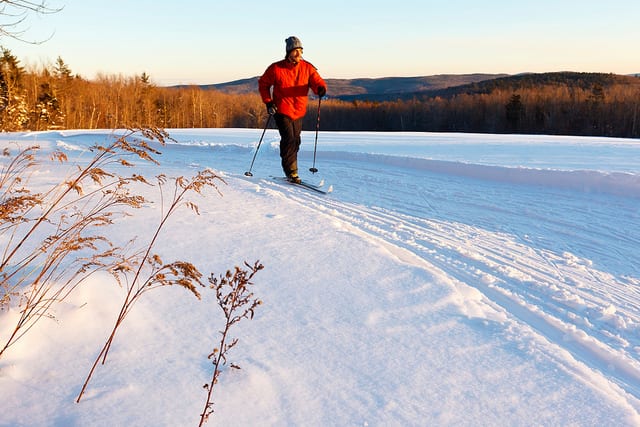 person cross country skiing maine