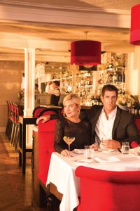 Photo of a Couple Dining at Natalie's. Click Here for 15 Winter Date Ideas.