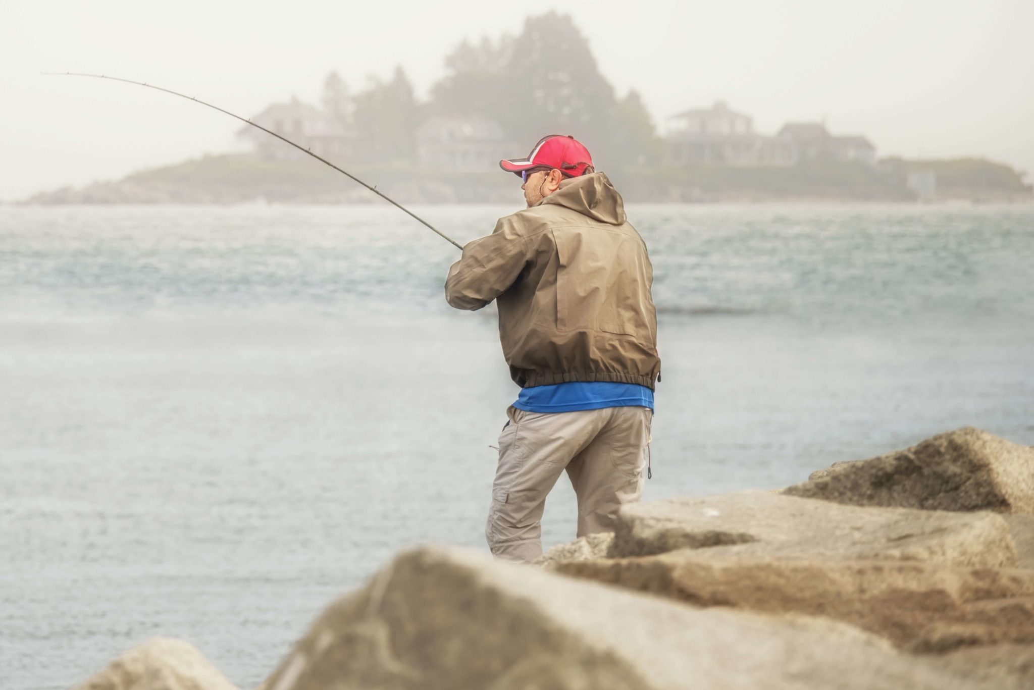 A man enjoying his Maine fishing trips.