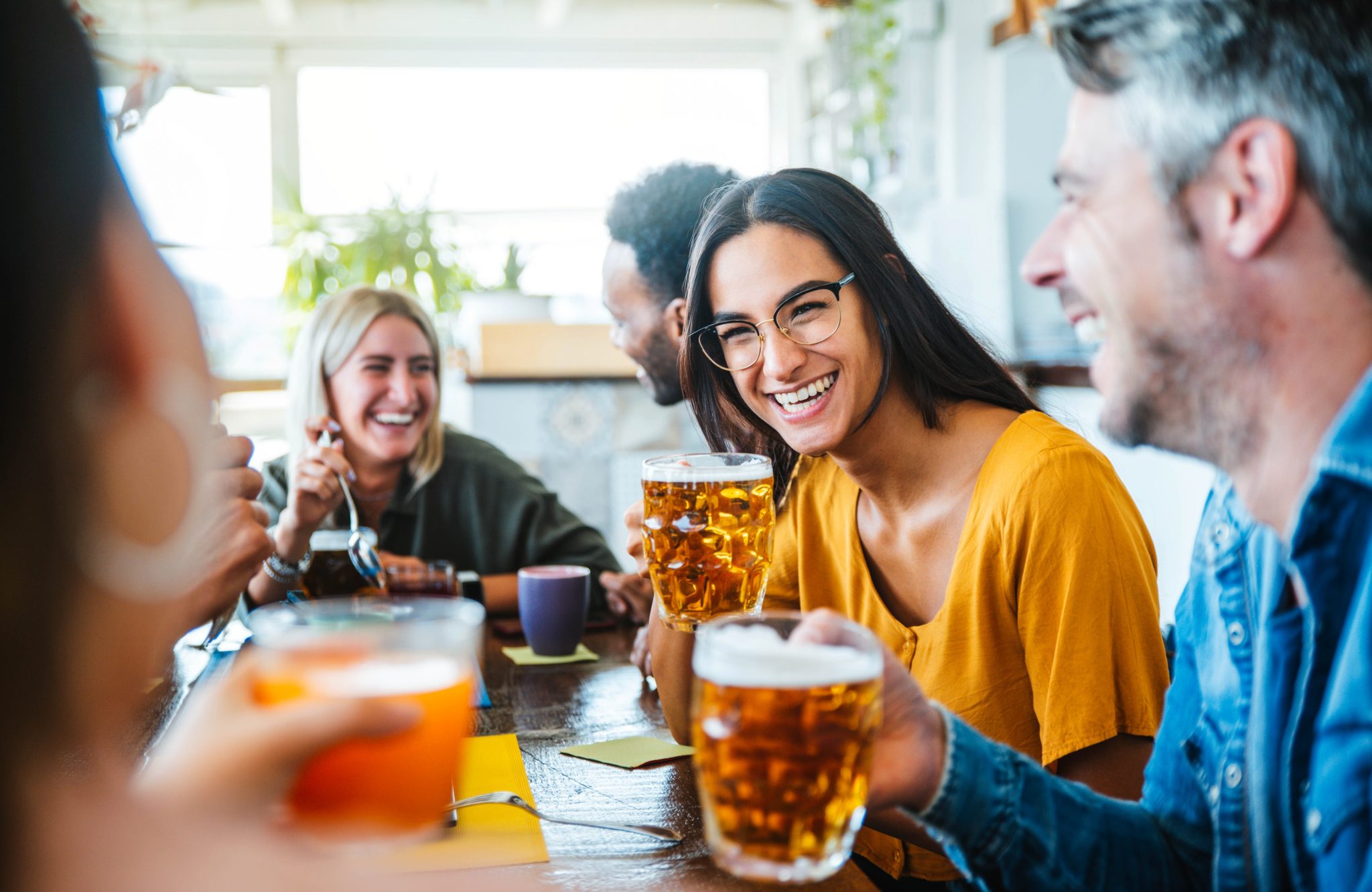A group of adults enjoying Breweries Near Camden, Maine.