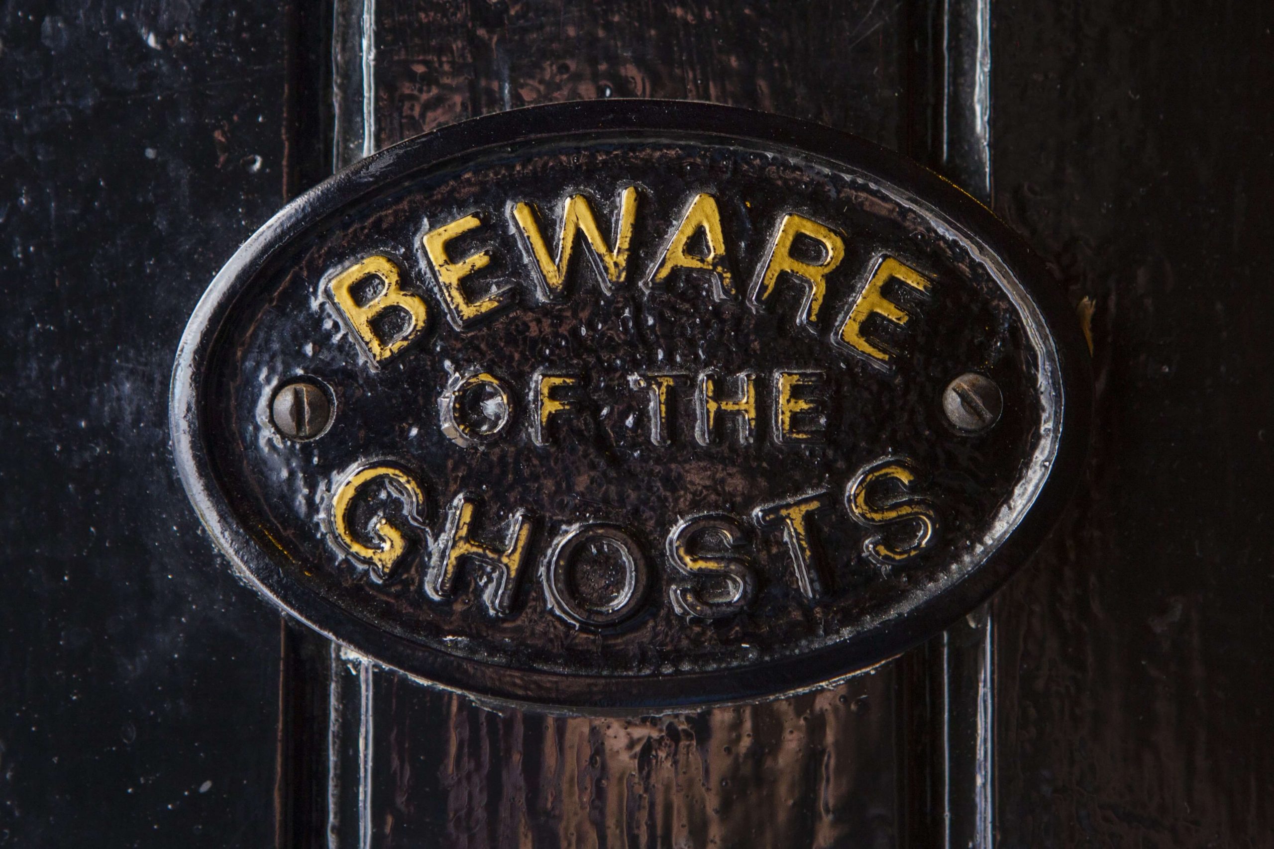 A door that says "Beware of the Ghosts" at Haunted Places In Maine.