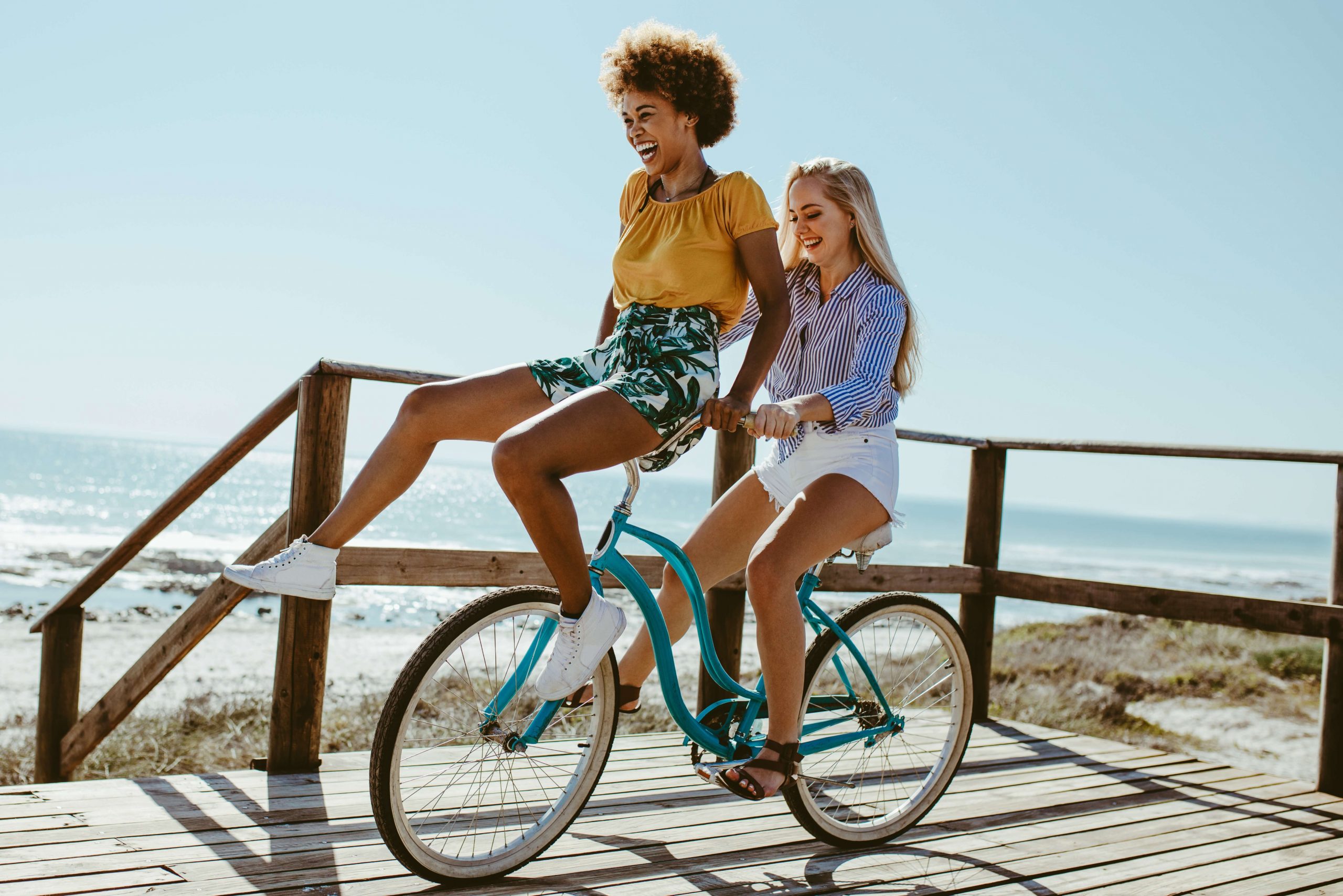 Two women on a bike in Camden, Maine.